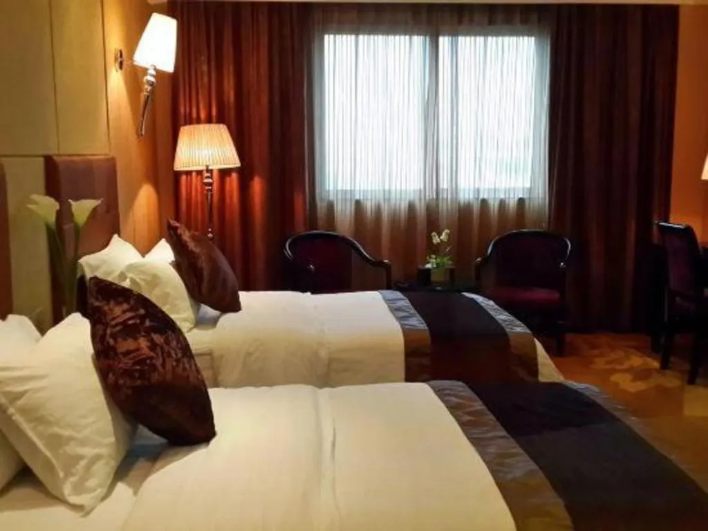 Bed in The Bmc Hotel