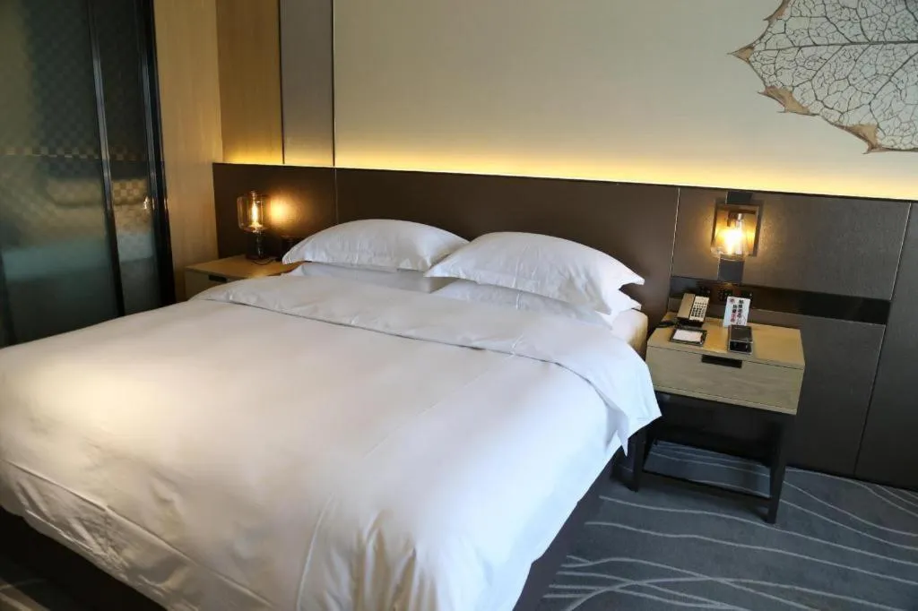 Bed in ZHONG DING HOTEL