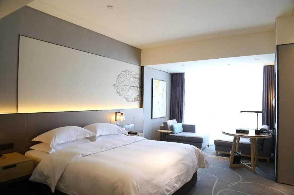 Bed in ZHONG DING HOTEL