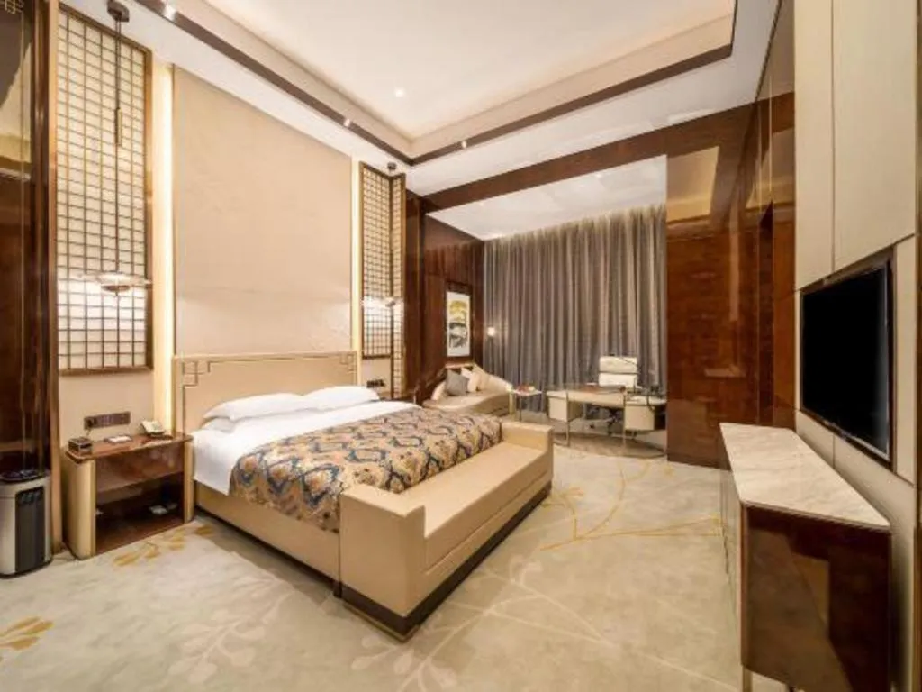 Bed in ZHONG DING HOTEL