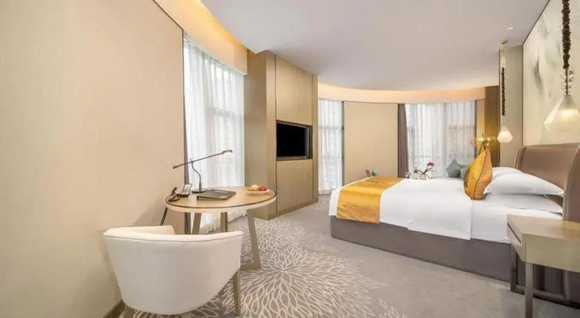 Bed in ZHONG DING HOTEL