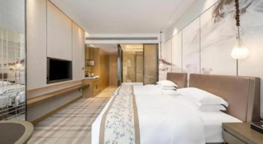 Bed in ZHONG DING HOTEL