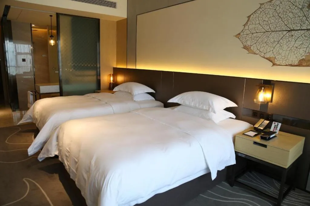 Bed in ZHONG DING HOTEL