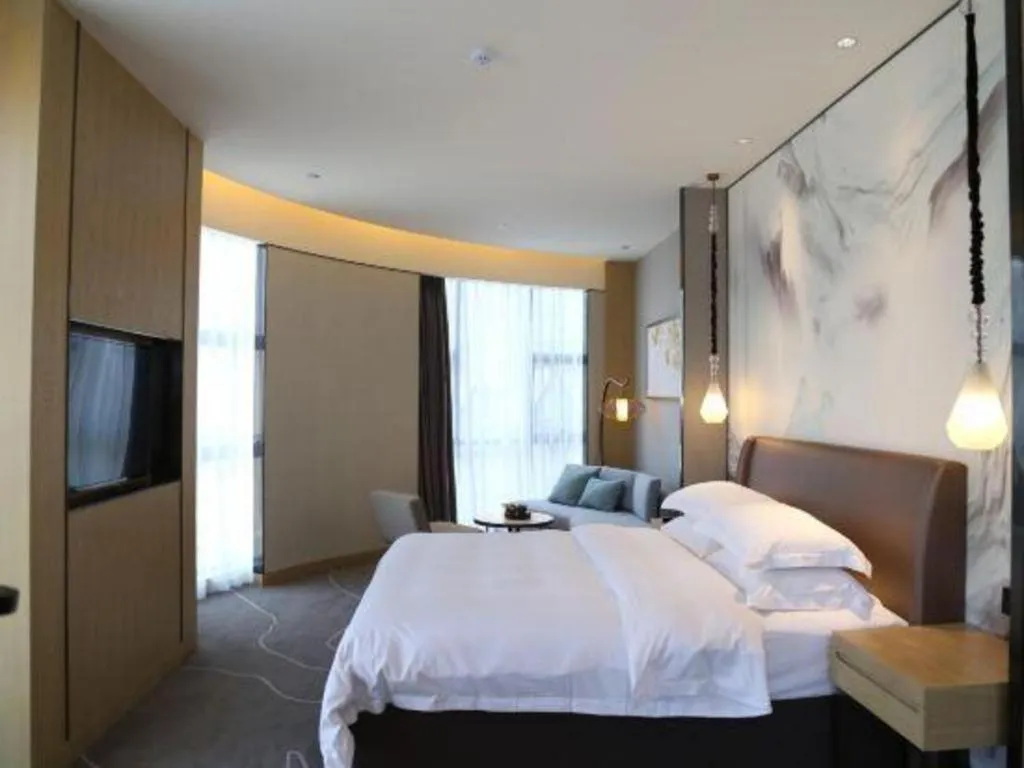 Bed in ZHONG DING HOTEL