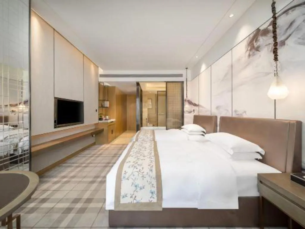 Bed in ZHONG DING HOTEL