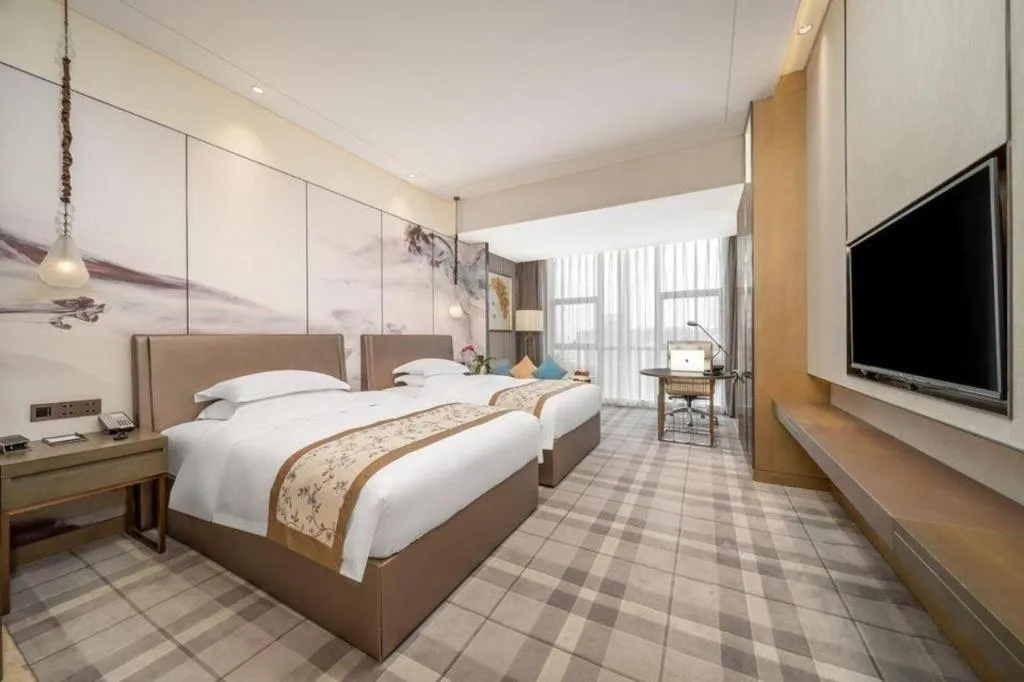 Bed in ZHONG DING HOTEL