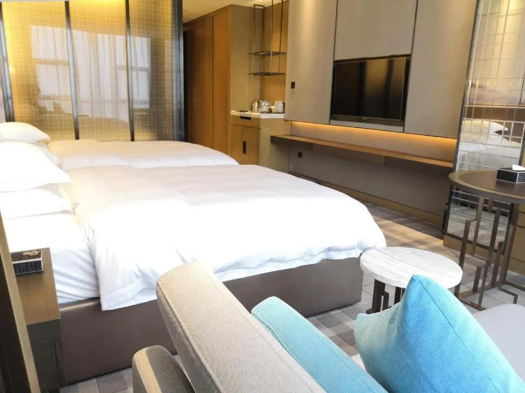 Bed in ZHONG DING HOTEL
