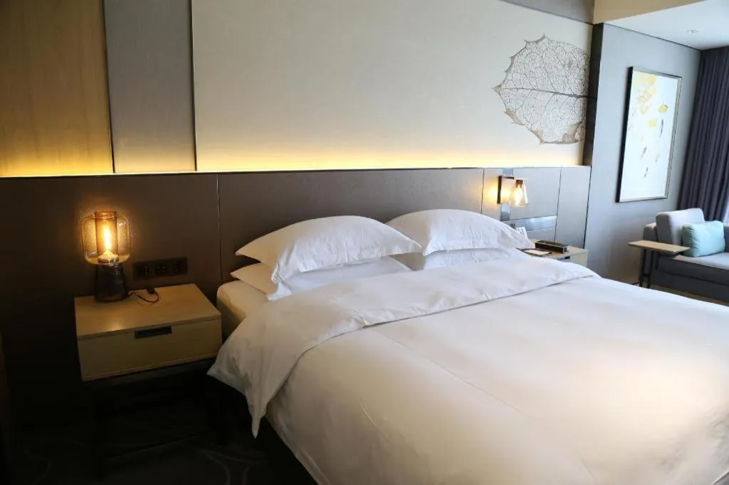 Bed in ZHONG DING HOTEL