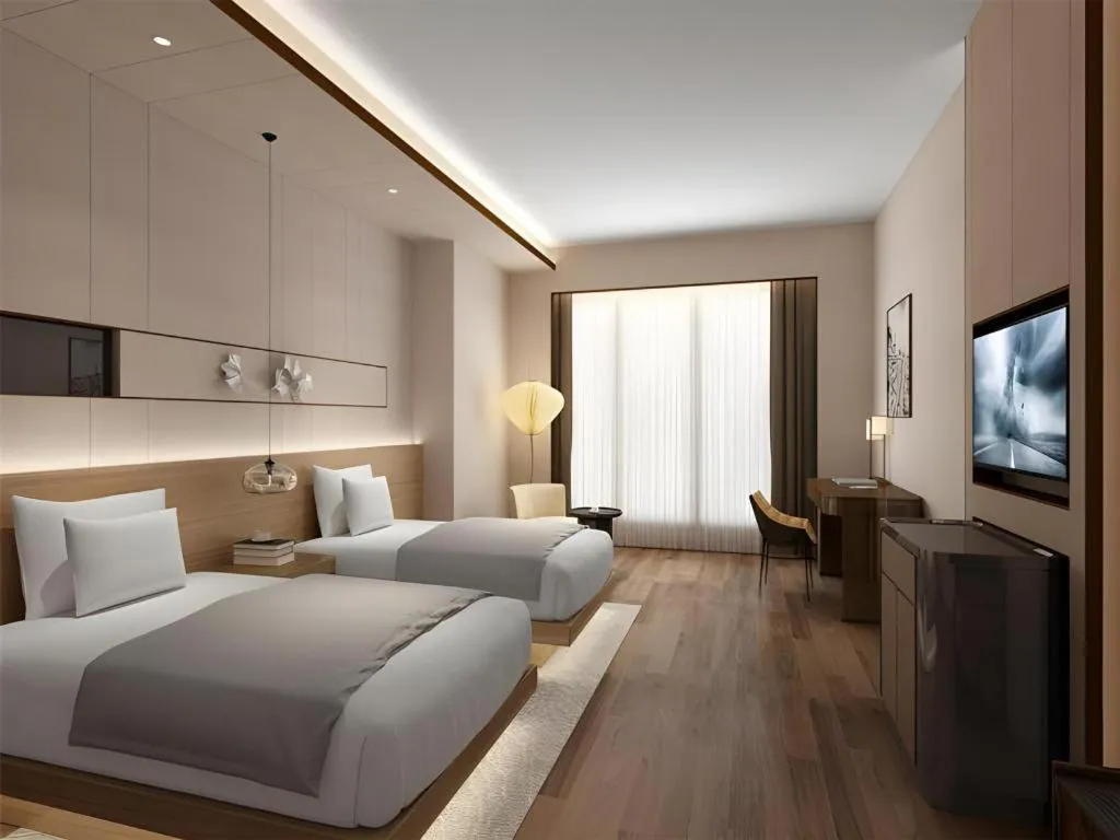 Bed in Metropolo Hotel YunNan Shangri-la Karma Dan Songzanlin Temple