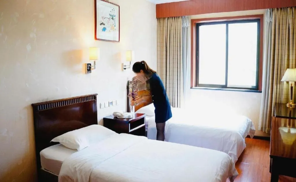 Bed in Hujialou Hot Spring Hotel