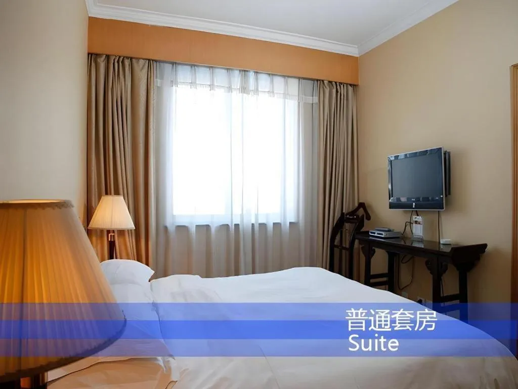 Bed in Hujialou Hot Spring Hotel