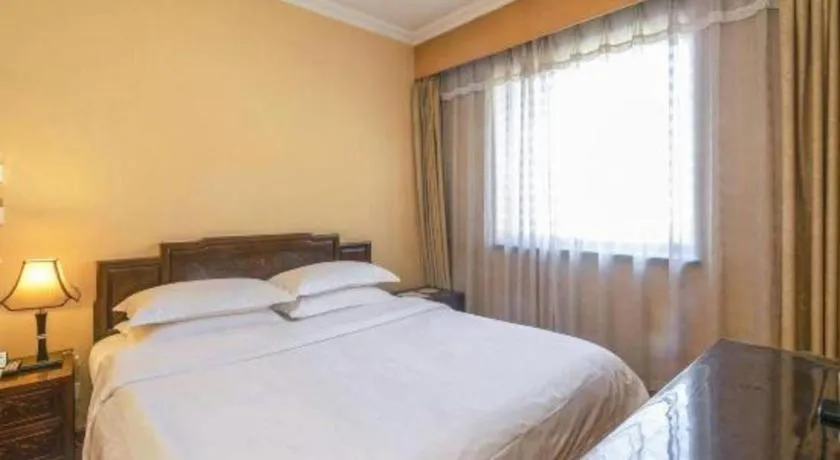 Bed in Hujialou Hot Spring Hotel