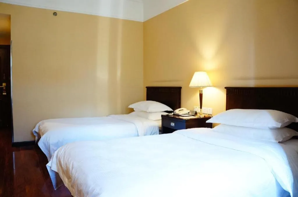 Bed in Hujialou Hot Spring Hotel