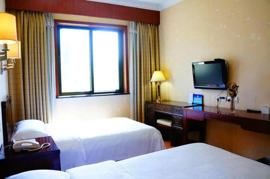 Bed in Hujialou Hot Spring Hotel