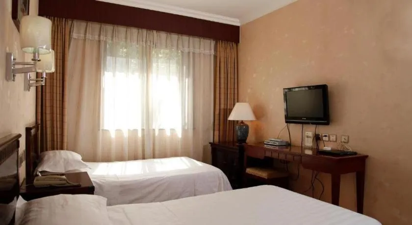 Bed in Hujialou Hot Spring Hotel