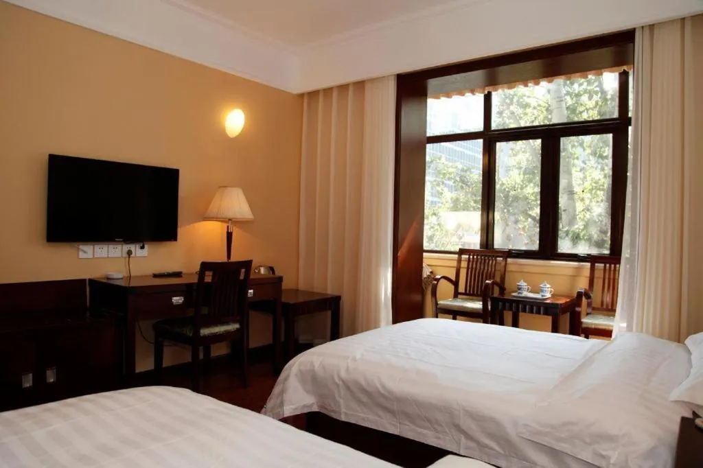 Bed in Hujialou Hot Spring Hotel