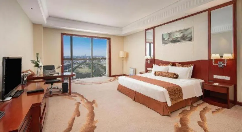 Bed in Longqi Jianguo Hotel Kunshan