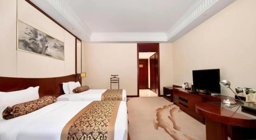 Bed in Longqi Jianguo Hotel Kunshan