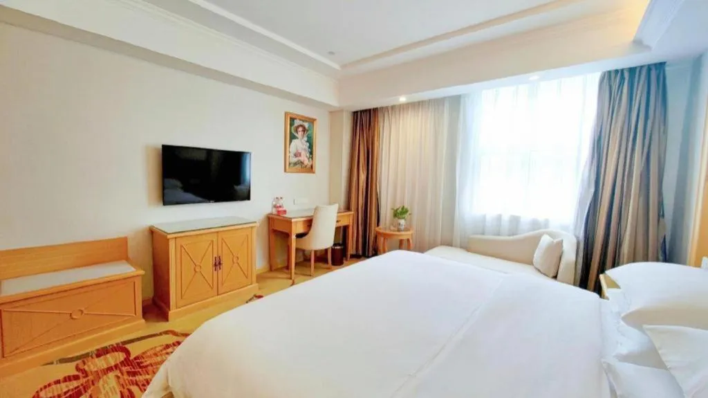 Bed in Vienna Hotel Shenzhen Longgang Baifucheng