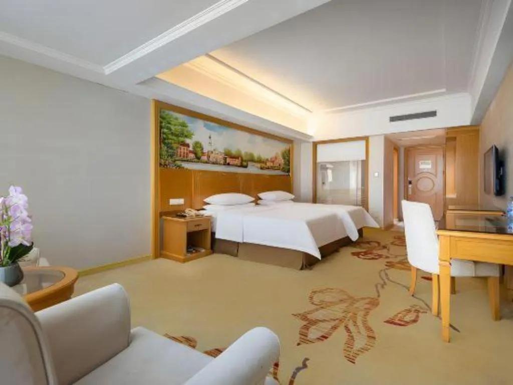Bed in Vienna Hotel Shenzhen Longgang Baifucheng