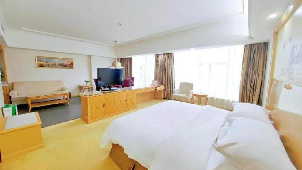 Bed in Vienna Hotel Shenzhen Longgang Baifucheng