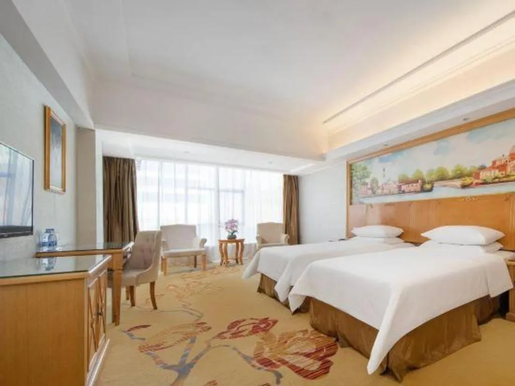Bed in Vienna Hotel Shenzhen Longgang Baifucheng