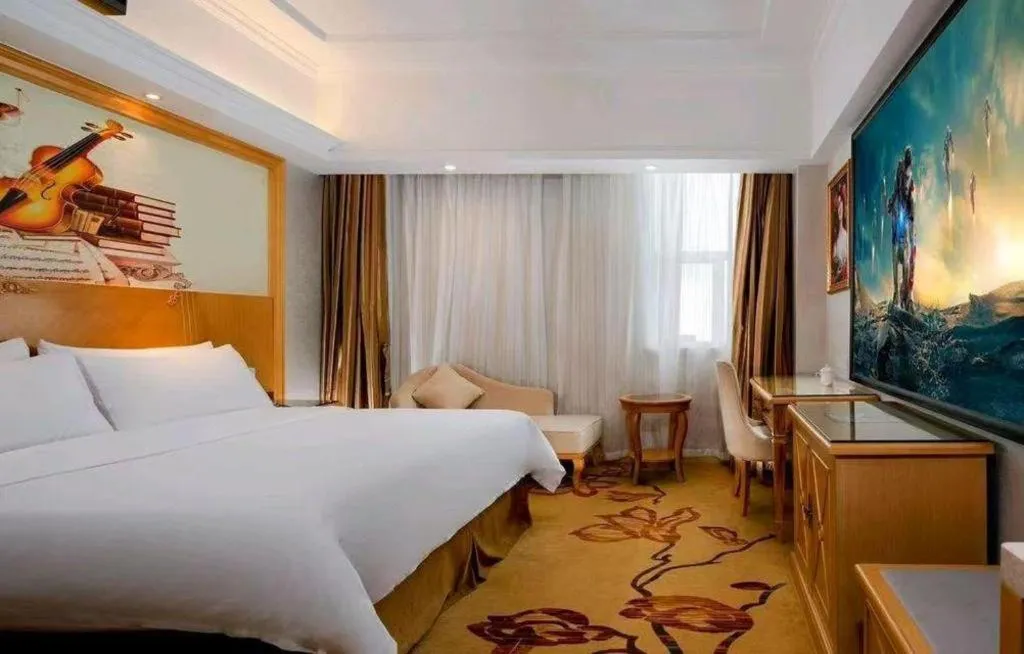 Bed in Vienna Hotel Shenzhen Longgang Baifucheng
