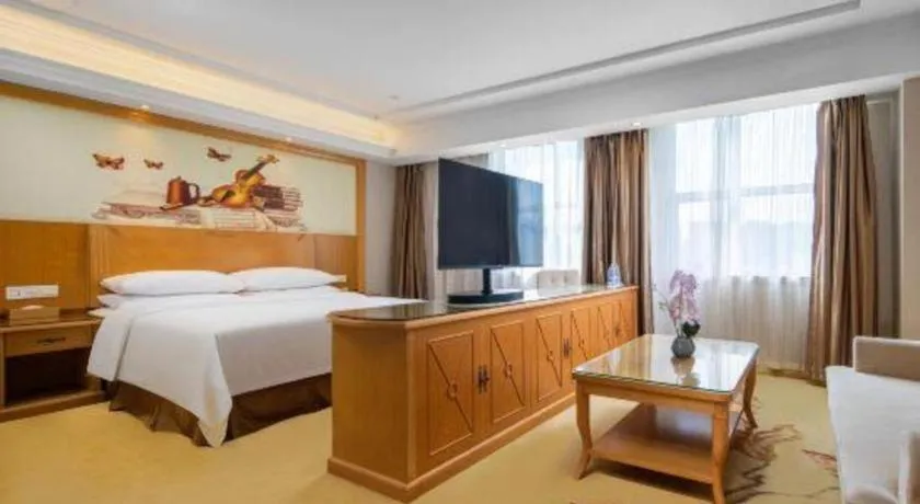 Bed in Vienna Hotel Shenzhen Longgang Baifucheng