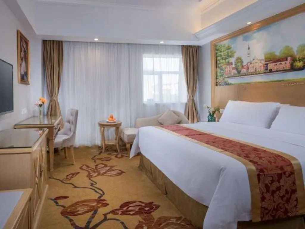 Bed in Vienna Hotel Shenzhen Longgang Baifucheng