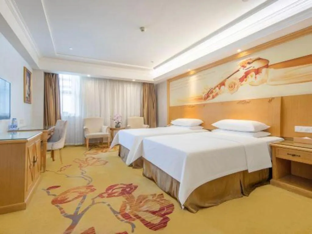 Bed in Vienna Hotel Shenzhen Longgang Baifucheng