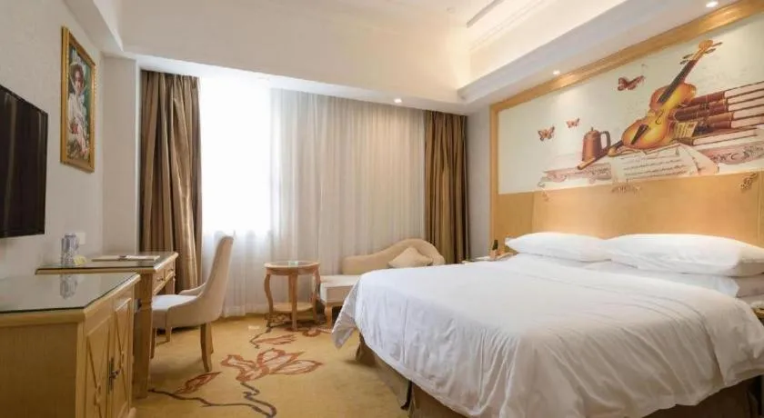 Bed in Vienna Hotel Shenzhen Longgang Baifucheng