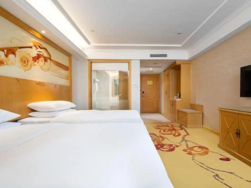 Bed in Vienna Hotel Shenzhen Longgang Baifucheng