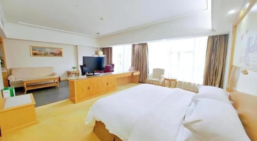 Bed in Vienna Hotel Shenzhen Longgang Baifucheng