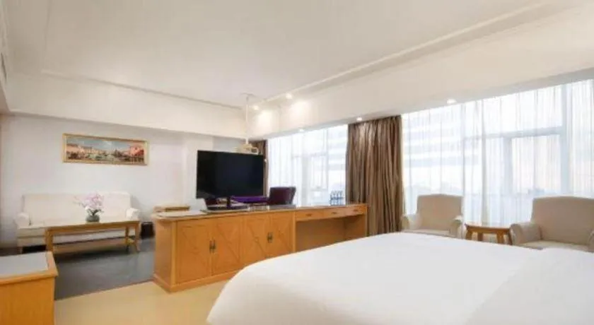 Bed in Vienna Hotel Shenzhen Longgang Baifucheng