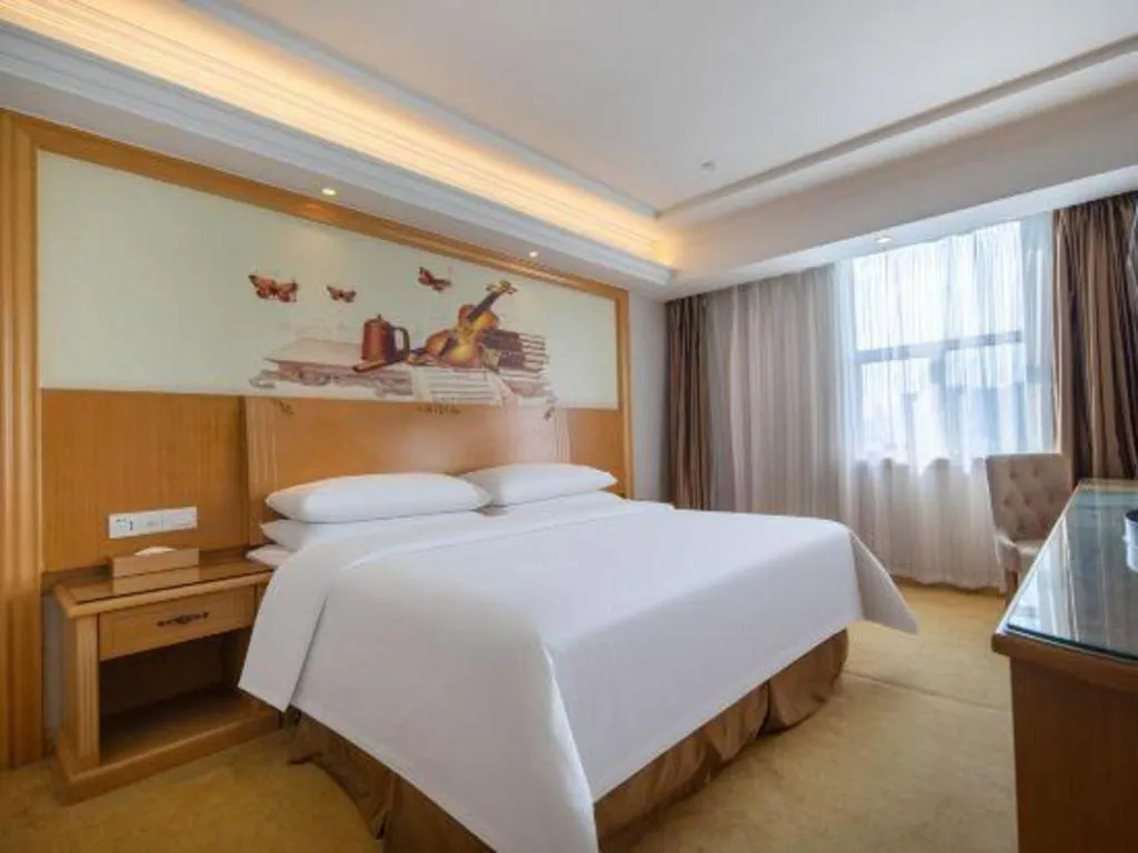Bed in Vienna Hotel Shenzhen Longgang Baifucheng
