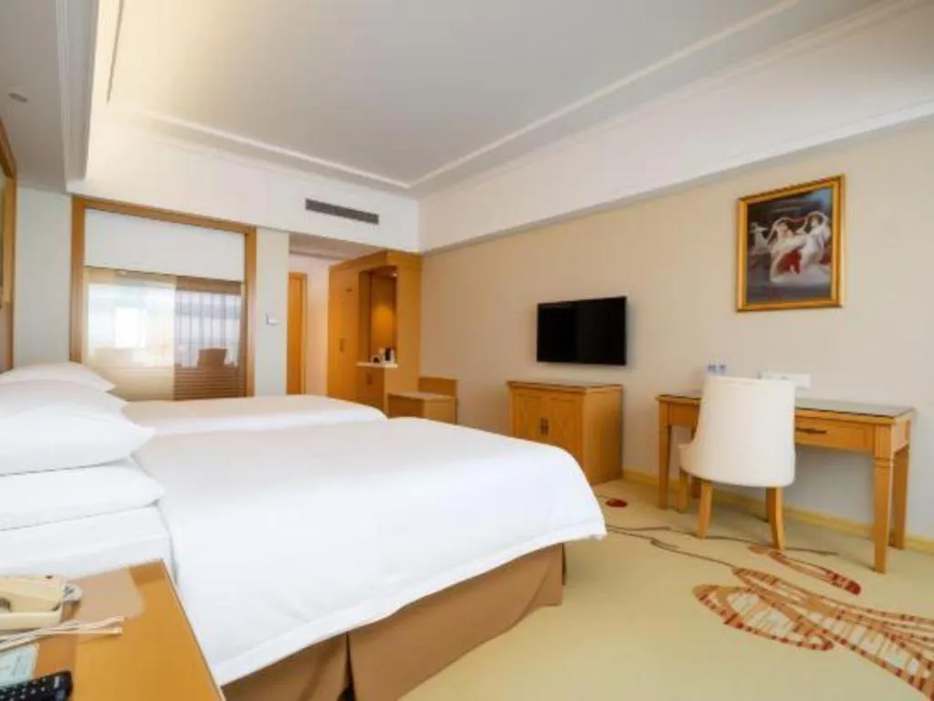 Bed in Vienna Hotel Shenzhen Longgang Baifucheng