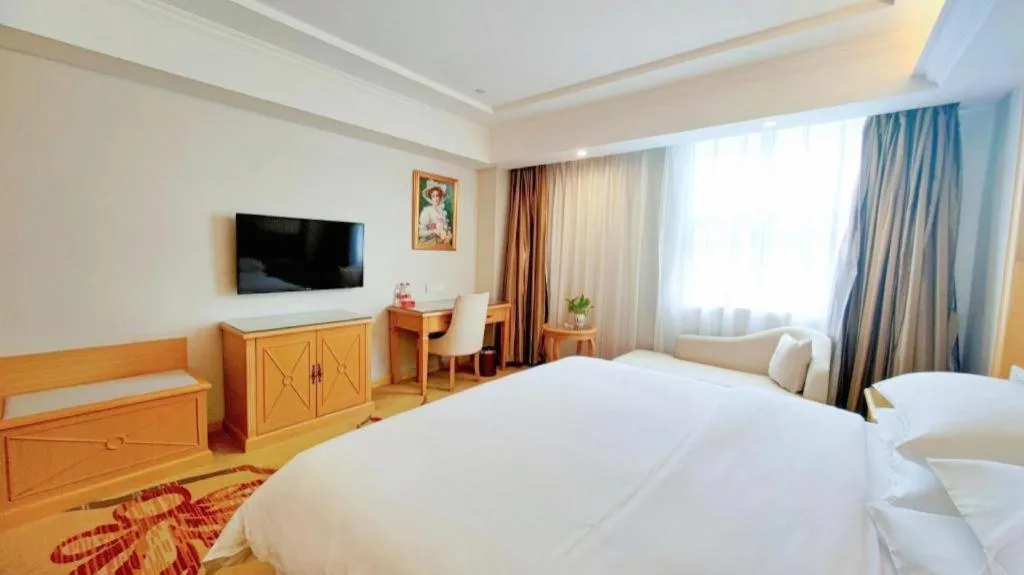 Bed in Vienna Hotel Shenzhen Longgang Baifucheng