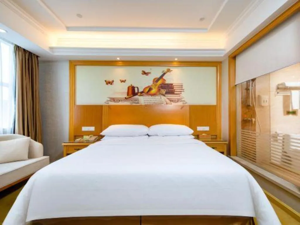 Bed in Vienna Hotel Shenzhen Longgang Baifucheng