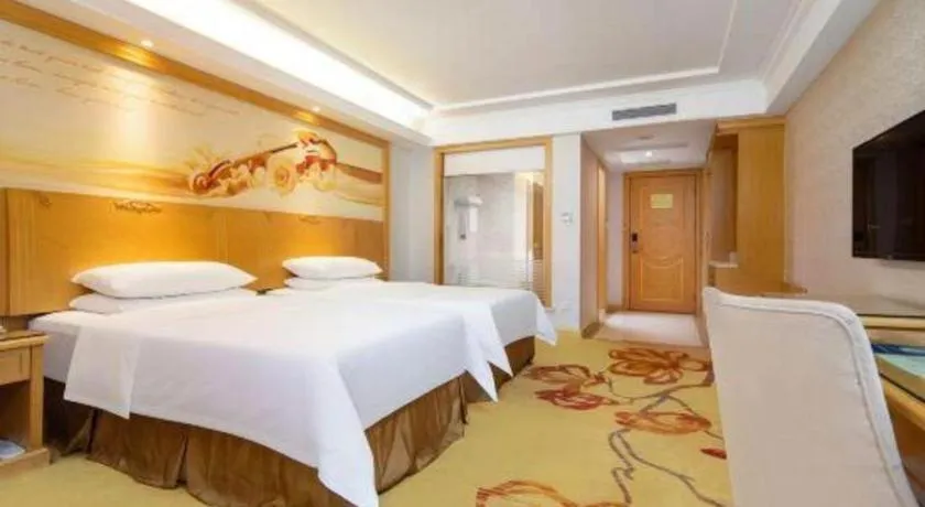 Bed in Vienna Hotel Shenzhen Longgang Baifucheng
