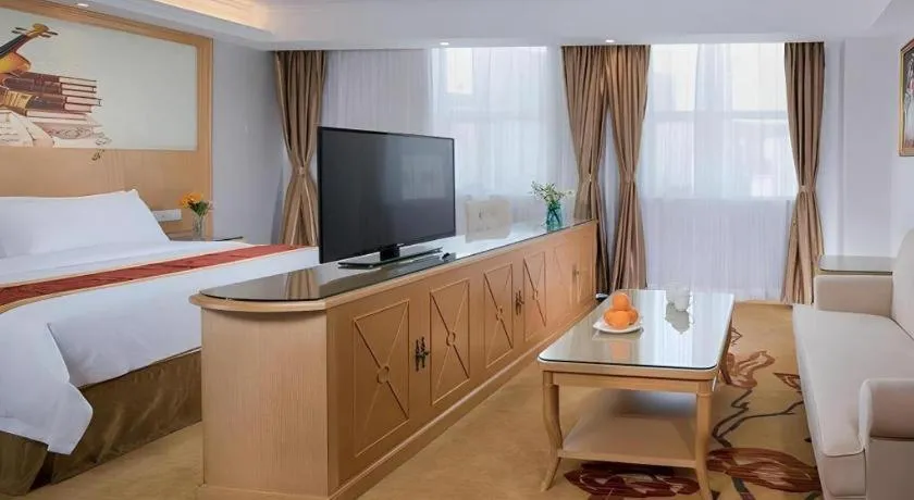 Bed in Vienna Hotel Shenzhen Longgang Baifucheng