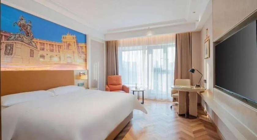Bed in Vienna Hotel Shenzhen Longgang Baifucheng