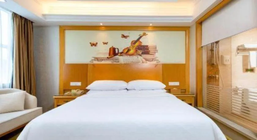 Bed in Vienna Hotel Shenzhen Longgang Baifucheng