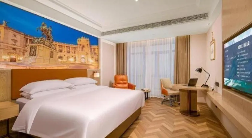 Bed in Vienna Hotel Shenzhen Longgang Baifucheng
