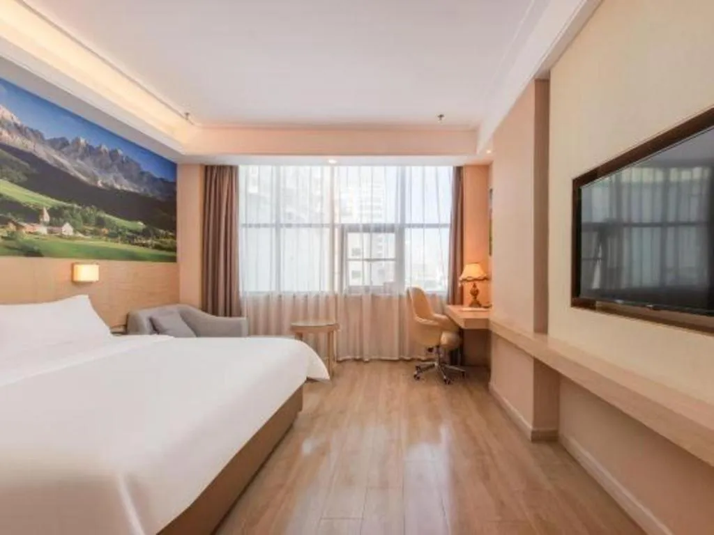 Bed in Vienna Hotel Shenzhen Longgang Baifucheng