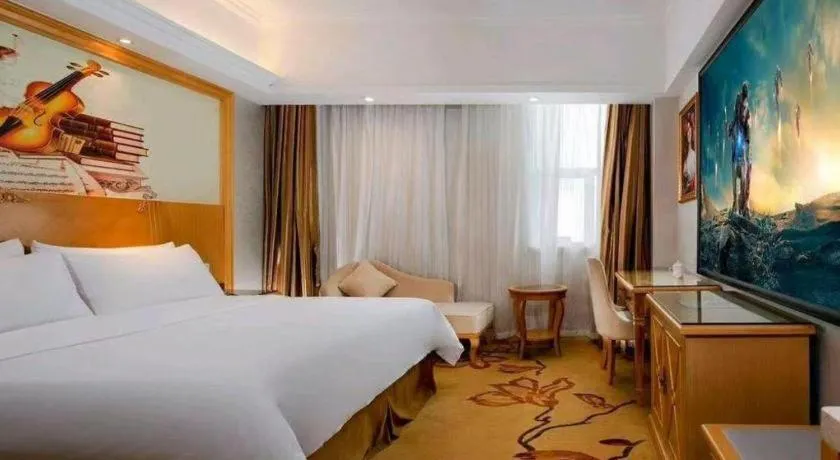 Bed in Vienna Hotel Shenzhen Longgang Baifucheng