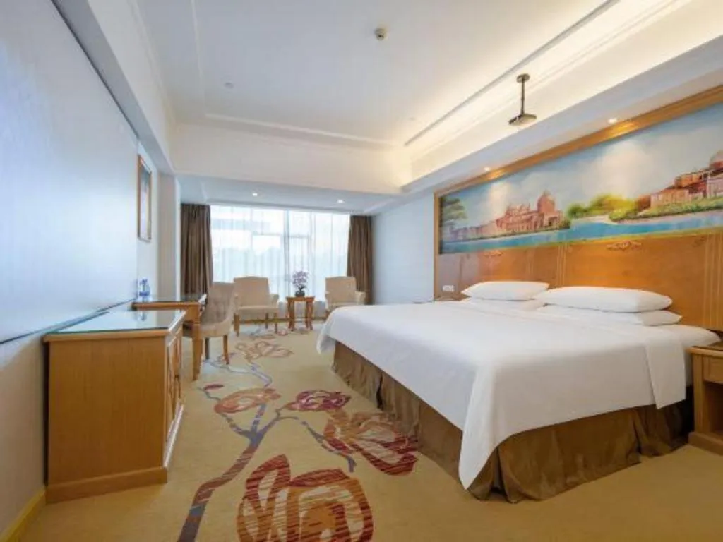 Bed in Vienna Hotel Shenzhen Longgang Baifucheng