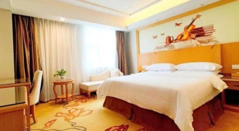 Bed in Vienna Hotel Shenzhen Longgang Baifucheng