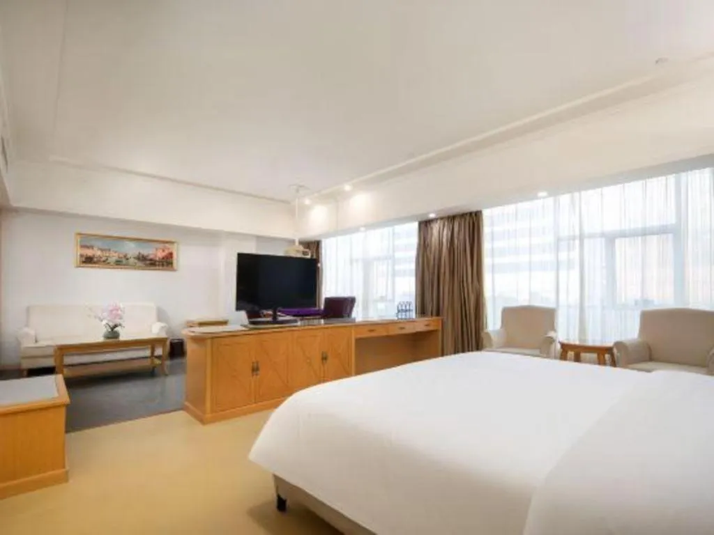 Bed in Vienna Hotel Shenzhen Longgang Baifucheng