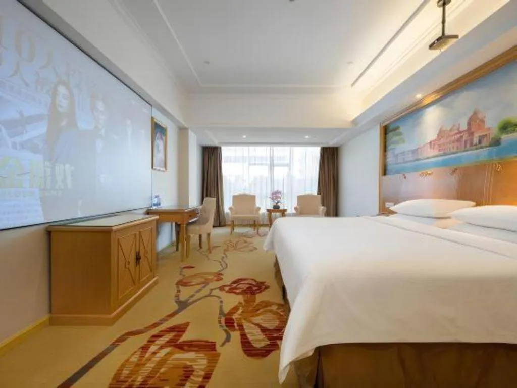 Bed in Vienna Hotel Shenzhen Longgang Baifucheng