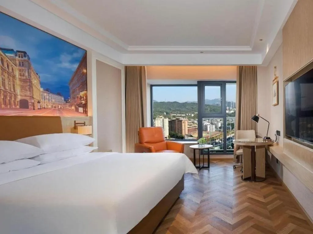 Bed in Vienna Hotel Shenzhen Longgang Baifucheng